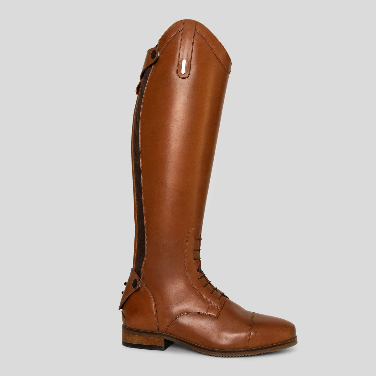 A tall brown leather riding boot shown in profile against a solid light gray background.