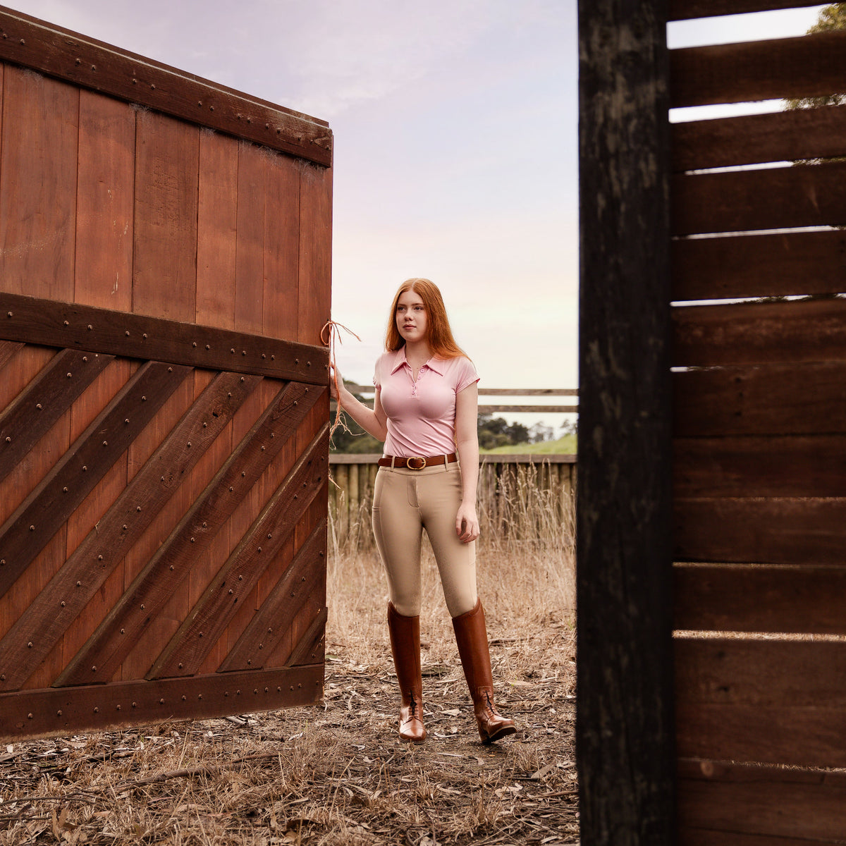 Brown tall riding boots with elastic laces and zip