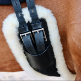 Anatomic dressage girth with cream sheepskin