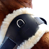 Anatomic dressage girth with cream sheepskin