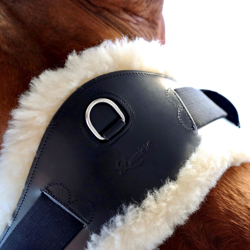 Anatomic dressage girth with cream sheepskin